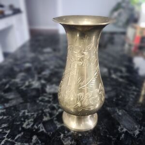 This is a vintage etched brass vase,  of Indian origin. 